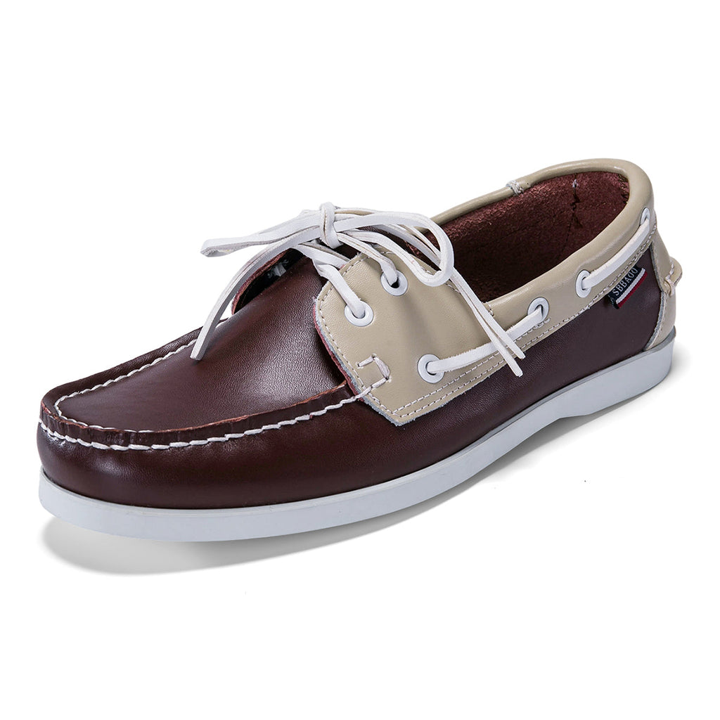 Men's leather boat shoes in brown and beige, angled view